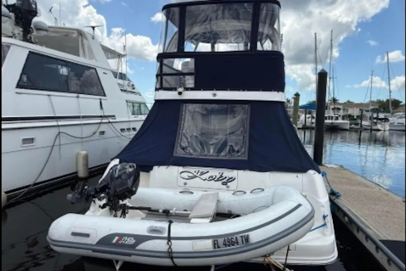 Slide: The Image of 2006 Sea Ray 44 Sedan Bridge yacht docked with inflatable boat attached. - 3