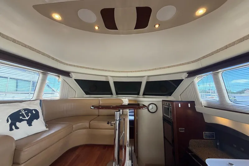 Slide: The Image of Luxurious interior of 2006 Sea Ray 44 Sedan Bridge yacht with elegant seating and modern amenities. - 31