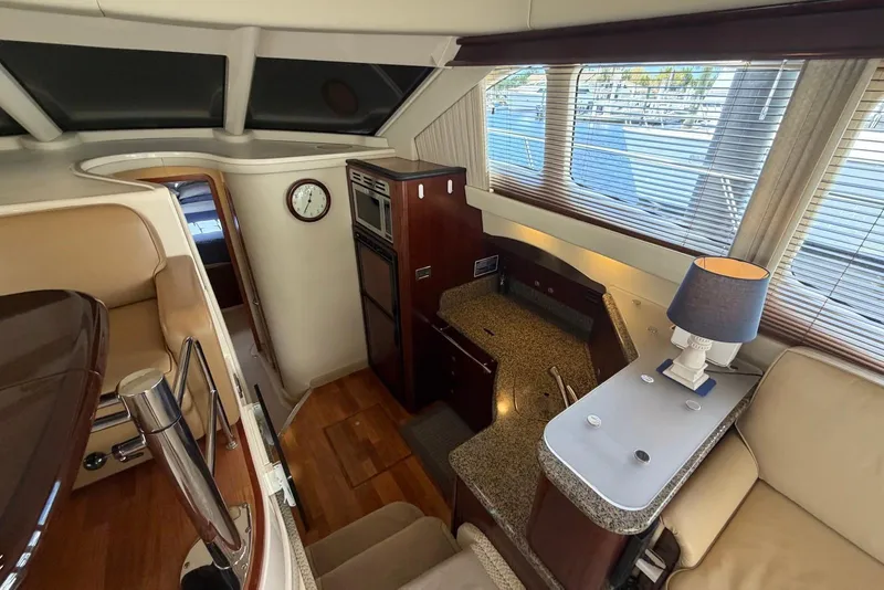 Slide: The Image of Luxurious interior of 2006 Sea Ray 44 Sedan Bridge yacht with elegant furnishings and modern amenities. - 33