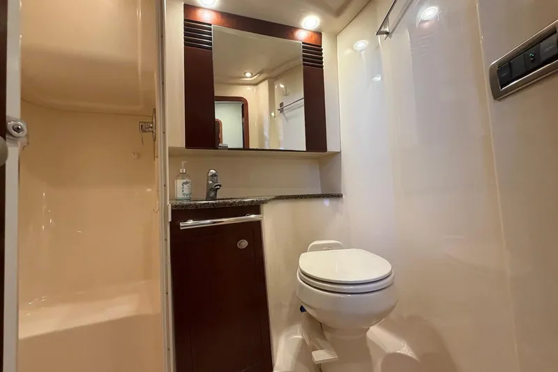 Slide: The Image of Under-bed storage on 2006 Sea Ray 44 Sedan Bridge yacht, revealing organized compartments. - 46