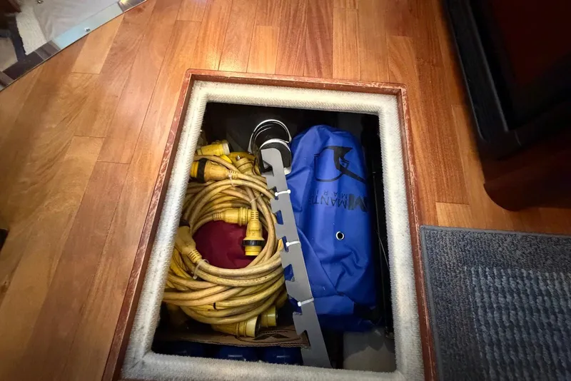 Slide: The Image of Interior of 2006 Sea Ray 44 Sedan Bridge with convertible sofa bed and nautical decor. - 49