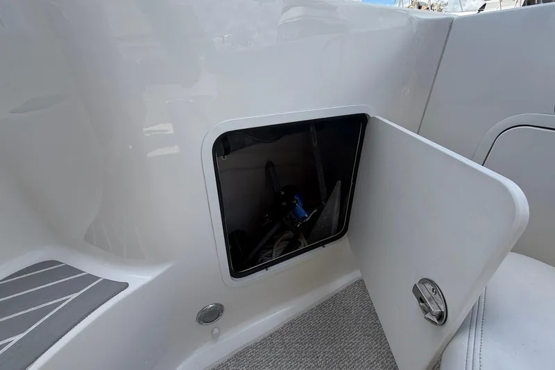 Slide: The Image of Storage compartment of a 2006 Sea Ray 44 Sedan Bridge with ropes and water treatment system. - 52