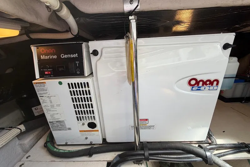 Slide: The Image of Engine room of a 2006 Sea Ray 44 Sedan Bridge with batteries and equipment. - 56