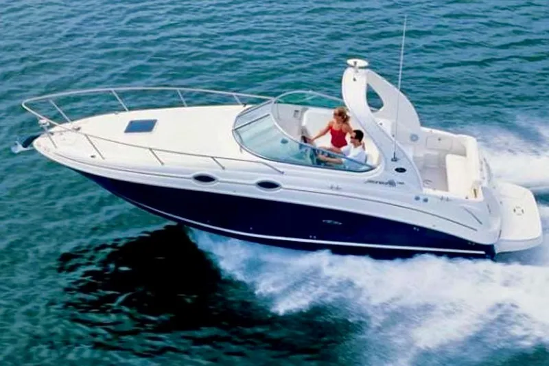 The Image of 2006 Sea Ray Sundancer 280 cruising on open water, showcasing sleek design and performance. - 0