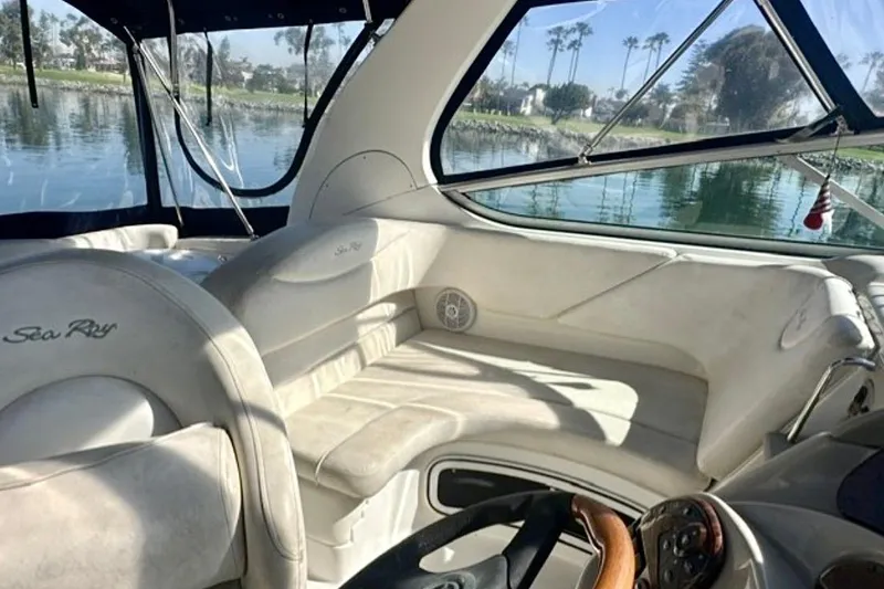 Slide: The Image of Interior of 2006 Sea Ray Sundancer 280 boat with plush seating and scenic water view. - 10
