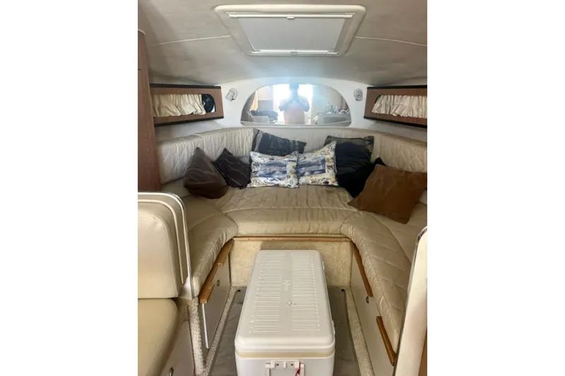 Slide: The Image of Interior of 2006 Sea Ray Sundancer 280 with cozy seating and cushions. - 15