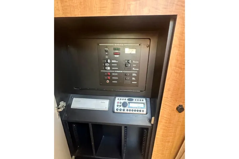 Slide: The Image of Electrical panel and control system inside a 2006 Sea Ray Sundancer 280 boat. - 19