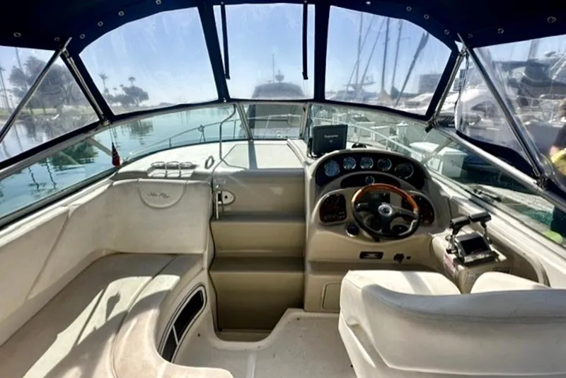 Slide: The Image of Interior view of 2006 Sea Ray Sundancer 280 boat cockpit with steering wheel and controls. - 8