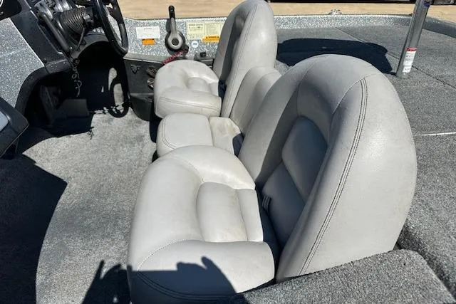Slide: The Image of 2007 Skeeter ZX250 boat interior with gray seating and steering console. - 14