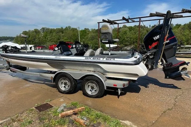 Slide: The Image of 2007 Skeeter ZX250 boat on trailer with Yamaha VMax engine, parked outdoors. - 4