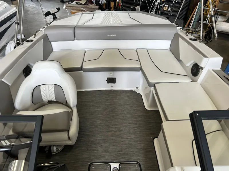 Slide: The Image of Interior of a 2022 Glastron 205 GTD boat with gray and white seating. - 10