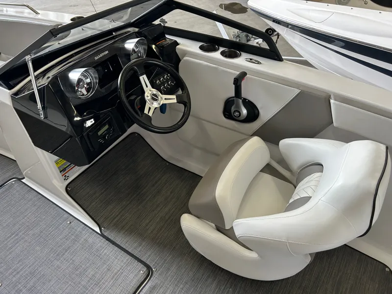 Slide: The Image of Interior of a 2022 Glastron 205 GTD boat with steering console. - 11