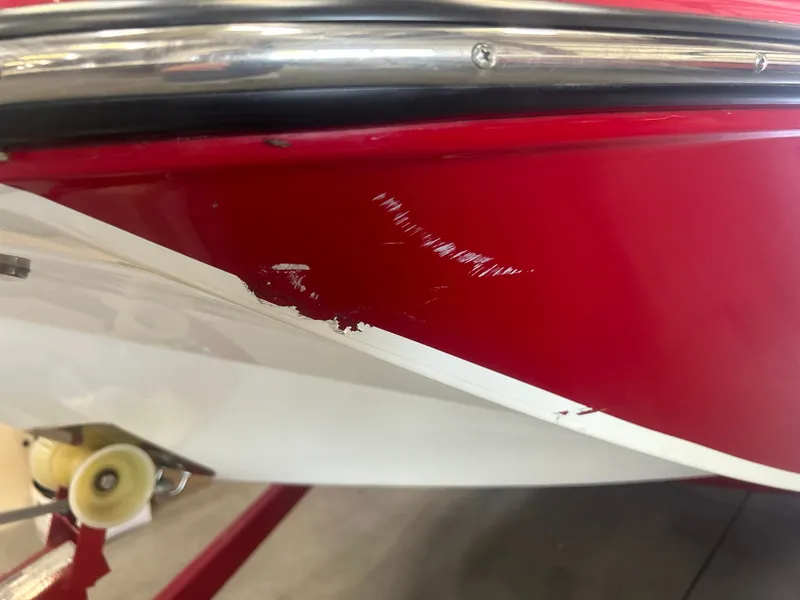 Slide: The Image of Close-up of damaged Glastron 205 GTD boat hull, 2022 model. - 24