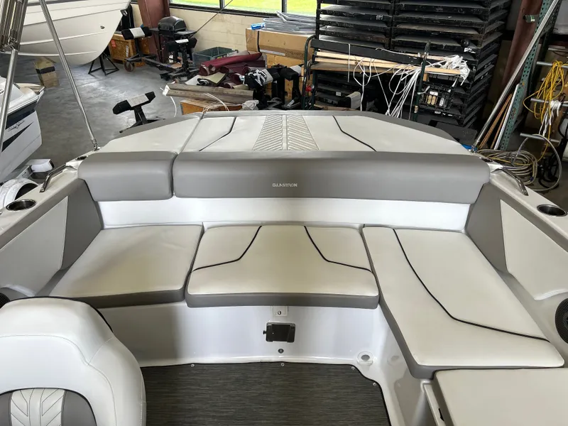 Slide: The Image of Interior of a 2022 Glastron 205 GTD boat with gray and white seating. - 7
