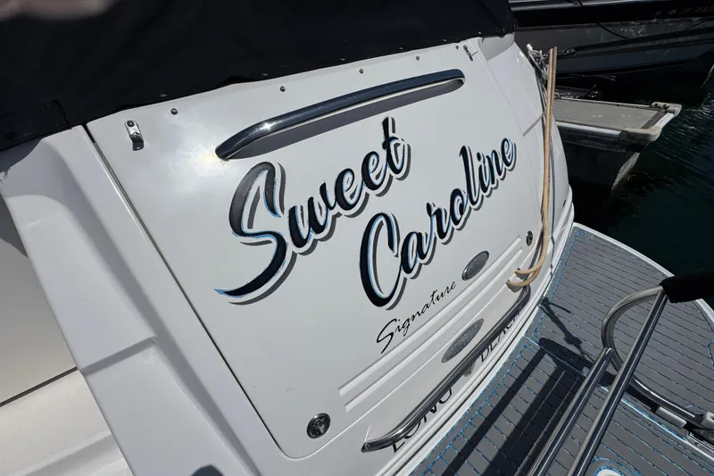 Slide: The Image of 2006 Chaparral Signature 350 boat named "Sweet Caroline" docked at marina. - 10