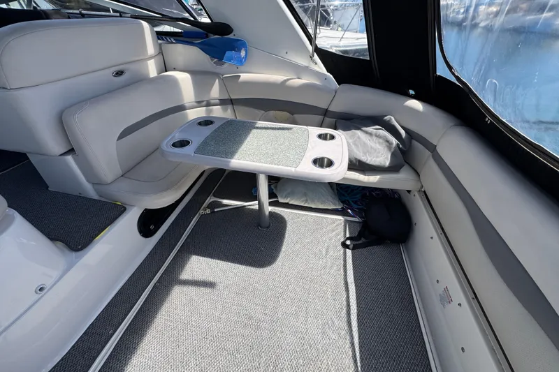 Slide: The Image of Interior of 2006 Chaparral Signature 350 boat with seating and table setup. - 12
