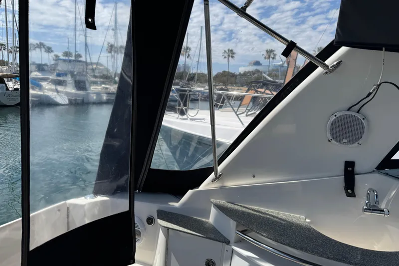 Slide: The Image of 2006 Chaparral Signature 350 boat interior with marina view and clear skies. - 15