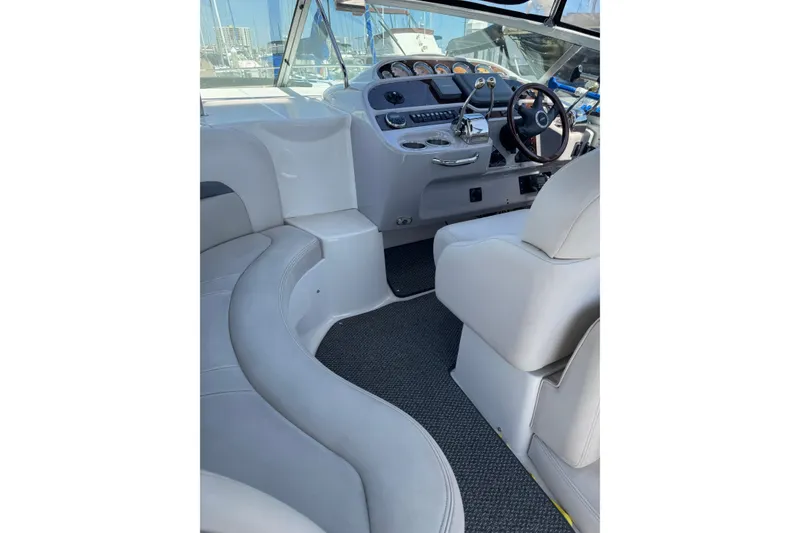 Slide: The Image of Interior of 2006 Chaparral Signature 350 boat with helm and seating area. - 18