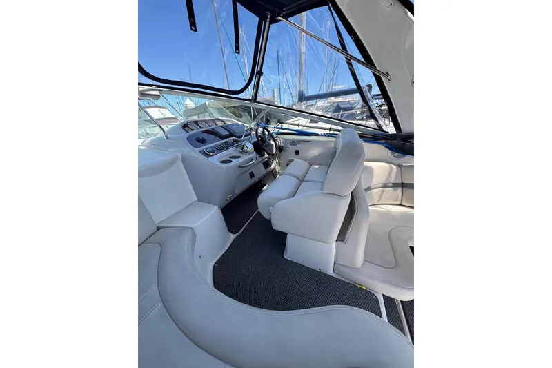 Slide: The Image of Interior of 2006 Chaparral Signature 350 boat with white seating and control panel. - 20