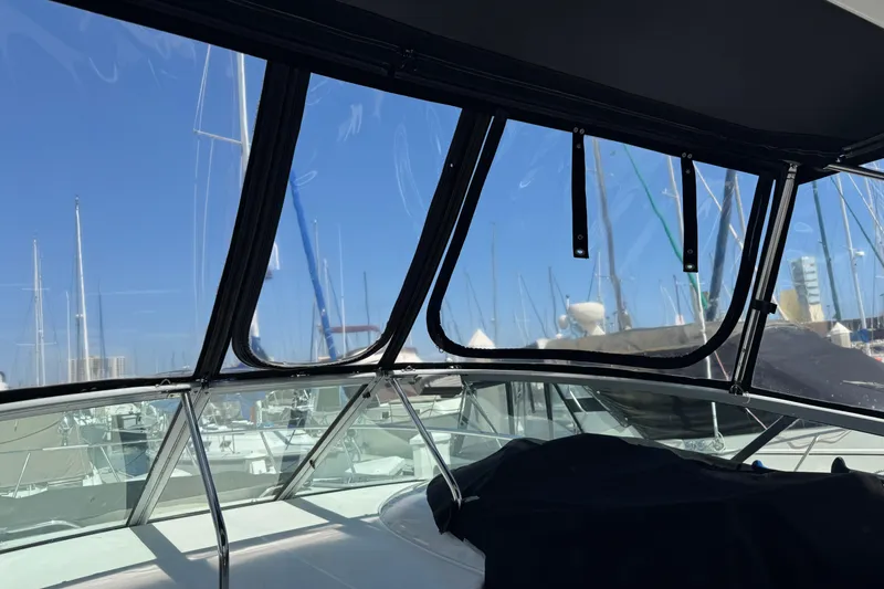 Slide: The Image of 2006 Chaparral Signature 350 boat interior with marina view through windows. - 21