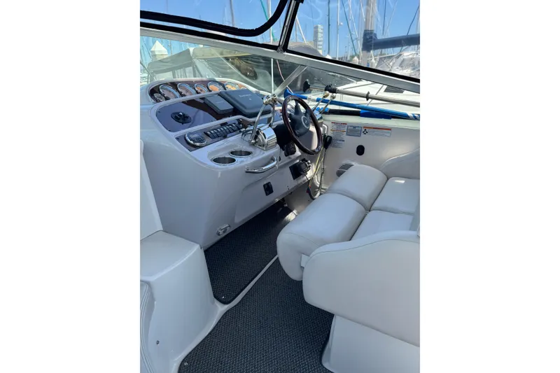 Slide: The Image of 2006 Chaparral Signature 350 boat cockpit with steering wheel and control panel. - 22
