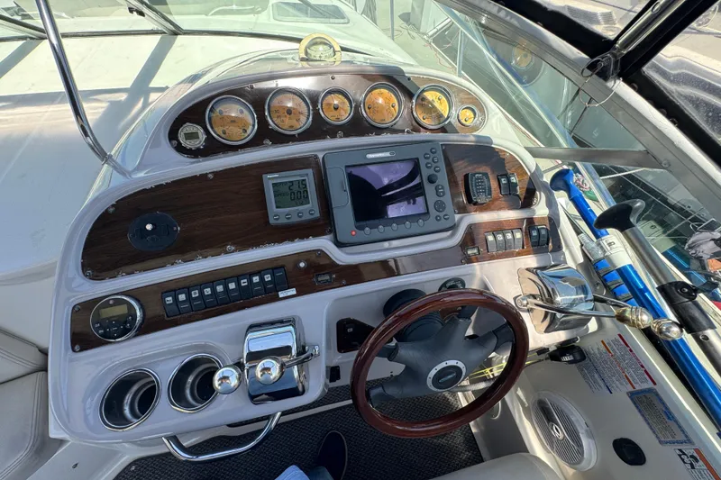 Slide: The Image of Helm of 2006 Chaparral Signature 350 with gauges, controls, and navigation equipment. - 23