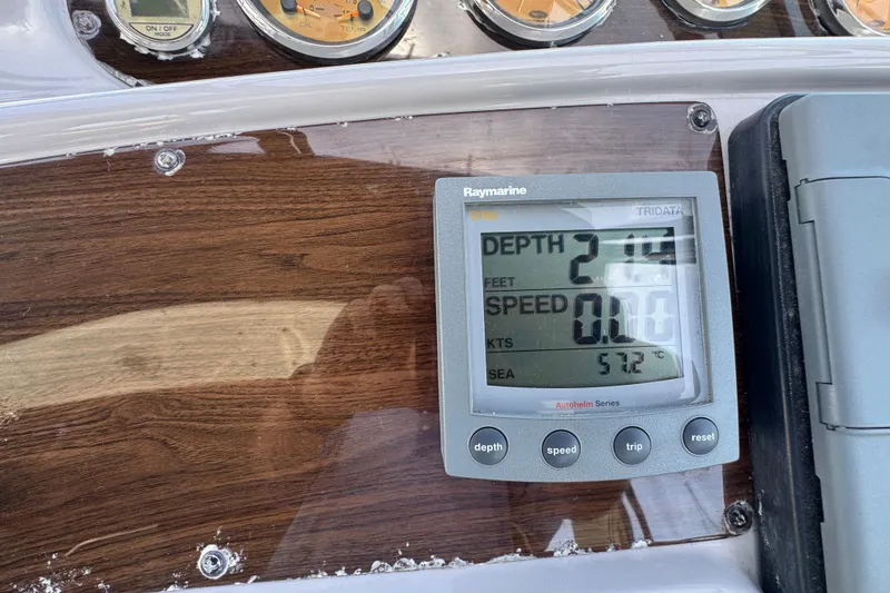Slide: The Image of Control panel of 2006 Chaparral Signature 350 boat with Raymarine display showing depth and speed. - 24