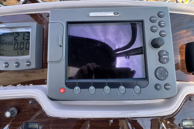 Slide: The Image of Control panel of a 2006 Chaparral Signature 350 boat with Raymarine display. - 25