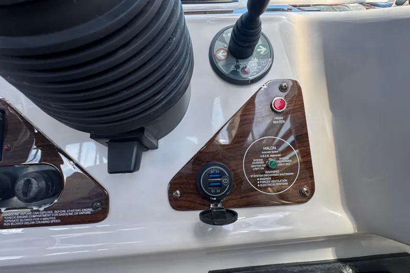Slide: The Image of Control panel of a 2006 Chaparral Signature 350 boat with switches and indicators. - 27