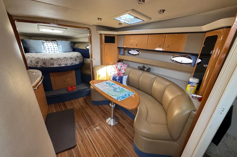 Slide: The Image of Luxurious 2006 Chaparral Signature 350 yacht interior with cozy seating and elegant wood finishes. - 32