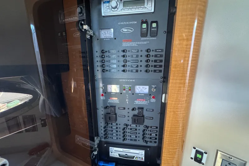 Slide: The Image of Electrical control panel inside a 2006 Chaparral Signature 350 boat cabin. - 36
