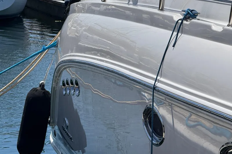 Slide: The Image of 2006 Chaparral Signature 350 yacht docked with ropes and fender. - 4