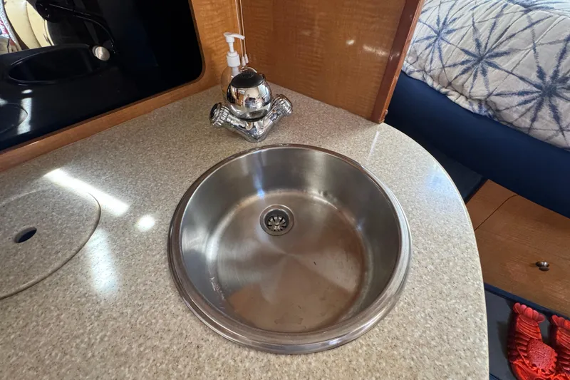 Slide: The Image of 2006 Chaparral Signature 350 boat interior with stainless steel sink and countertop. - 42