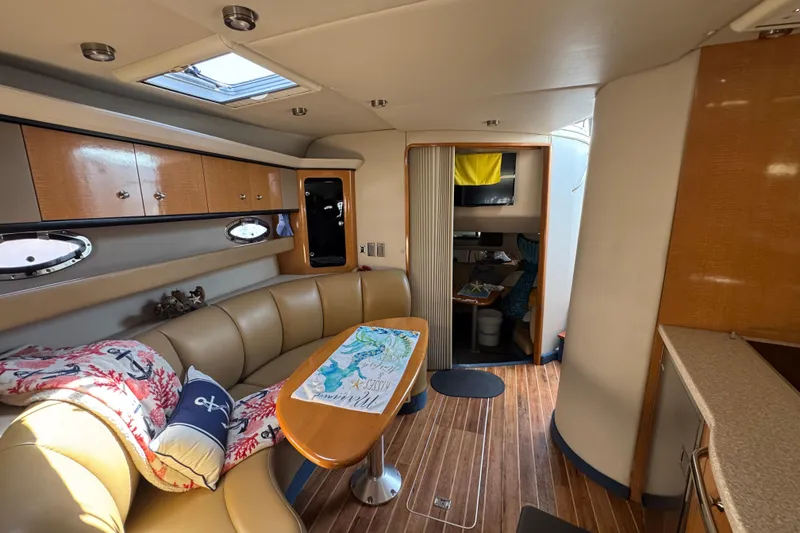 Slide: The Image of Interior of 2006 Chaparral Signature 350 yacht with cozy seating and wooden accents. - 48