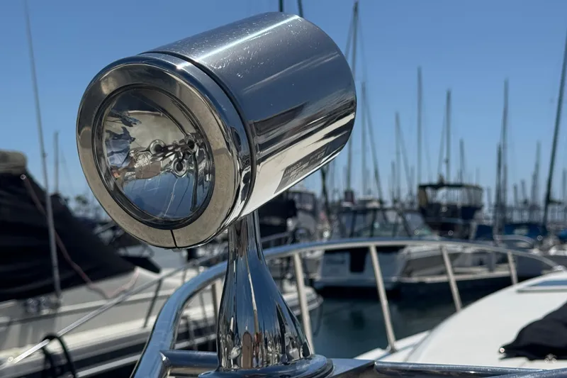 Slide: The Image of Chrome spotlight on 2006 Chaparral Signature 350 boat, marina background. - 5