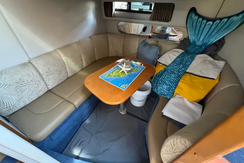 Slide: The Image of Interior of 2006 Chaparral Signature 350 boat with cozy seating and nautical decor. - 50