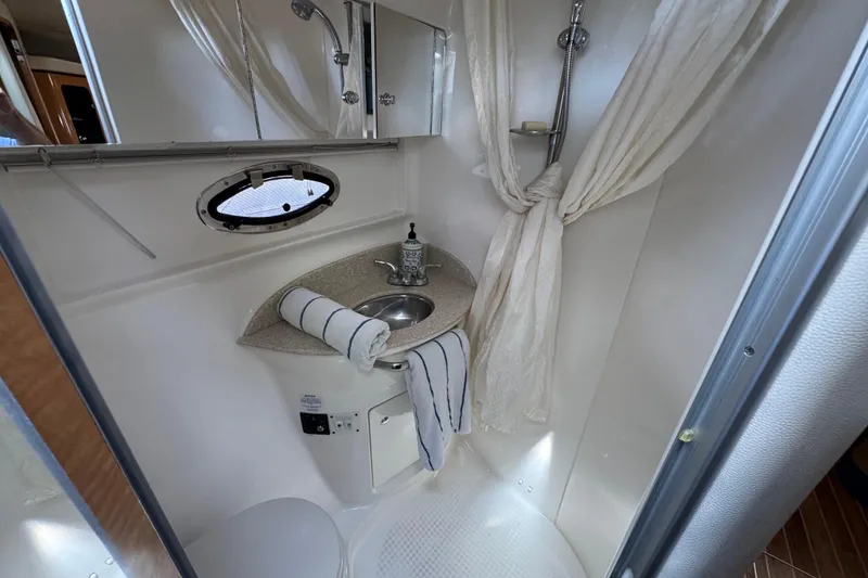 Slide: The Image of Bathroom interior of 2006 Chaparral Signature 350 yacht with sink and shower. - 53