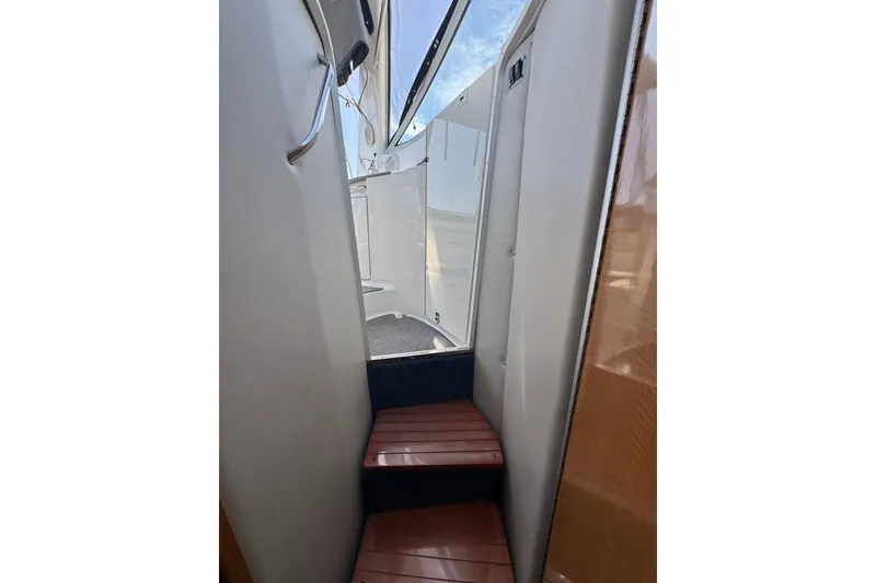 Slide: The Image of Stairway inside 2006 Chaparral Signature 350 yacht, leading to deck area. - 56