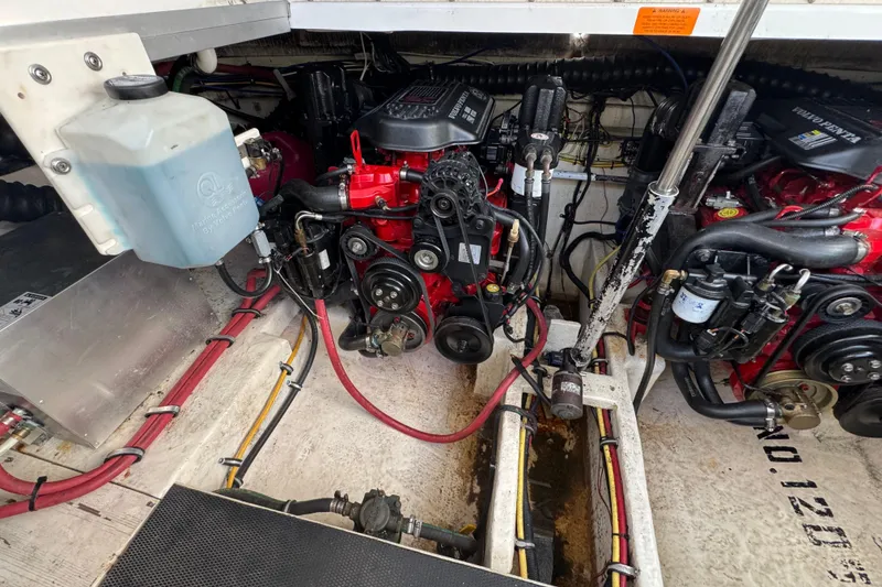 Slide: The Image of Engine compartment of a 2006 Chaparral Signature 350 boat, showcasing mechanical components. - 58