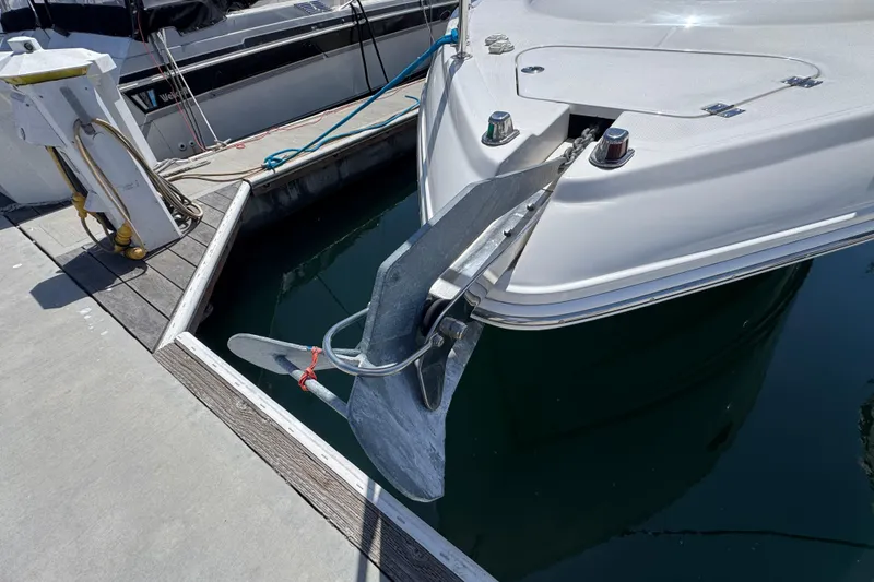 Slide: The Image of Bow of a 2006 Chaparral Signature 350 yacht with anchor at marina dock. - 6