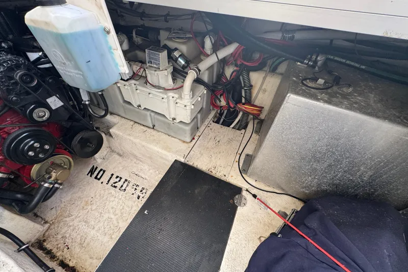 Slide: The Image of Engine compartment of a 2006 Chaparral Signature 350 boat, showing mechanical components. - 60
