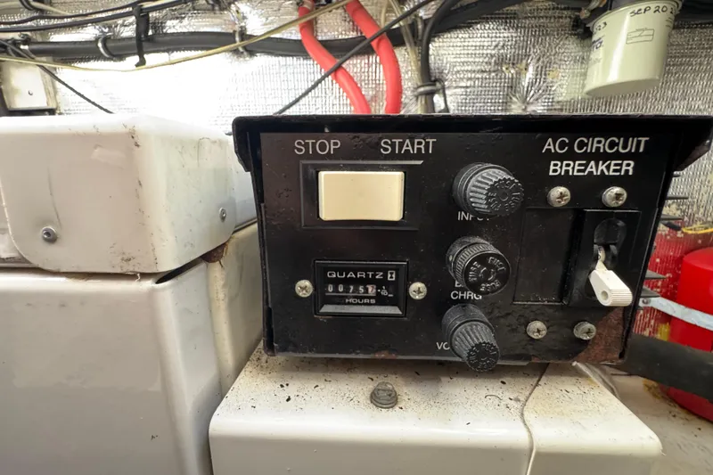 Slide: The Image of Control panel of a 2006 Chaparral Signature 350 boat with circuit breaker and hour meter. - 63