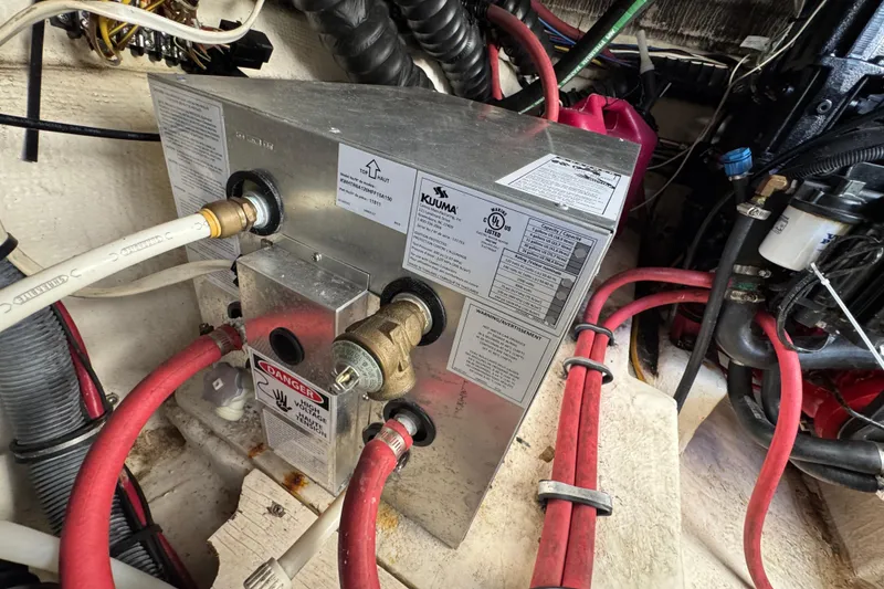 Slide: The Image of Engine compartment of a 2006 Chaparral Signature 350 with wiring and components. - 64