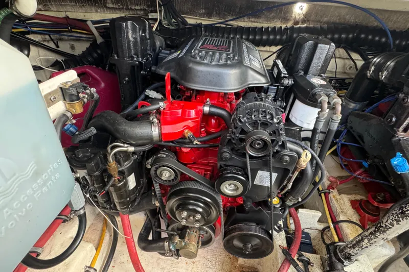 Slide: The Image of Engine compartment of a 2006 Chaparral Signature 350 boat, featuring a detailed view of the engine. - 65