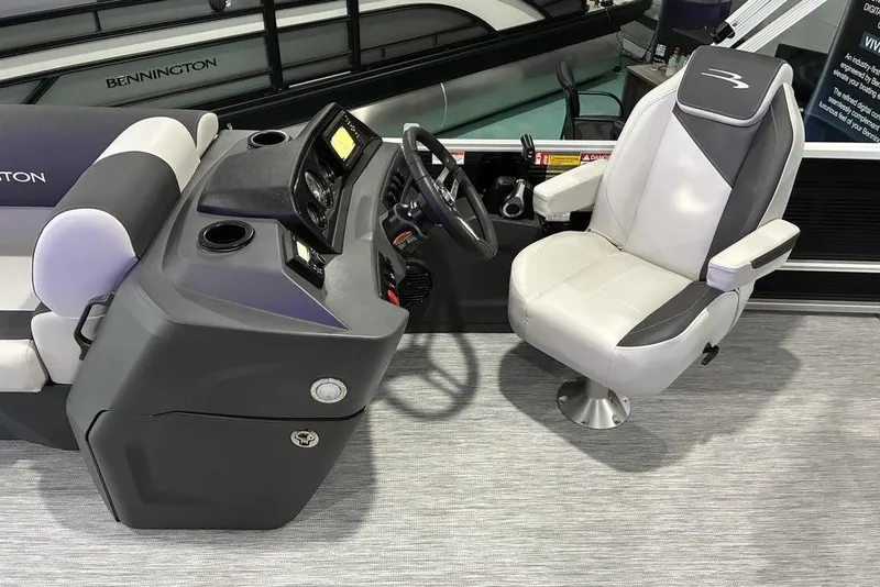 Slide: The Image of Captain's chair and helm of 2026 Bennington SWINGBACK 22 pontoon boat, featuring modern controls. - 9