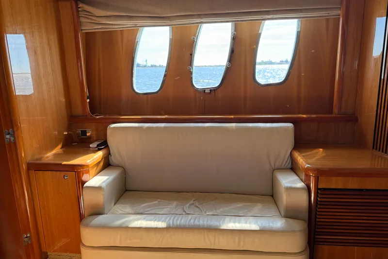 Slide: The Image of Luxurious interior of a 2005 Sunseeker 75 Yacht with leather seating and ocean view. - 18