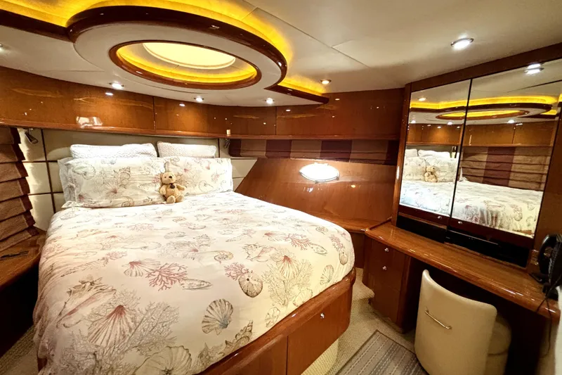 Slide: The Image of Luxurious 2005 Sunseeker 75 Yacht bedroom with elegant wood finishes and plush bedding. - 23