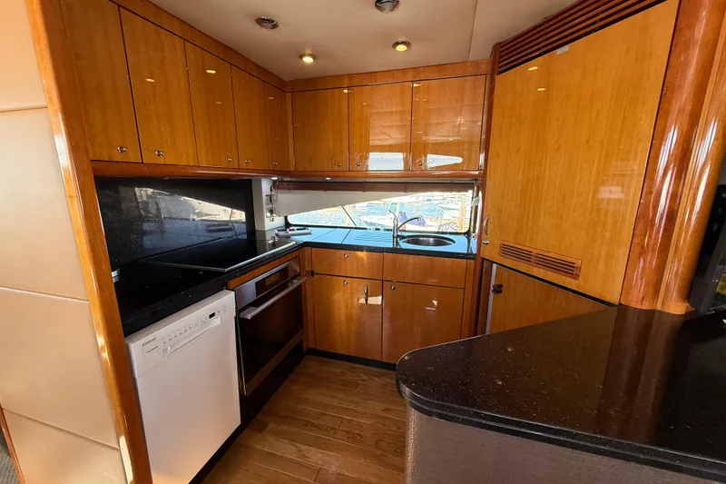 Slide: The Image of Luxurious kitchen interior of 2005 Sunseeker 75 Yacht with wood cabinetry and modern appliances. - 8