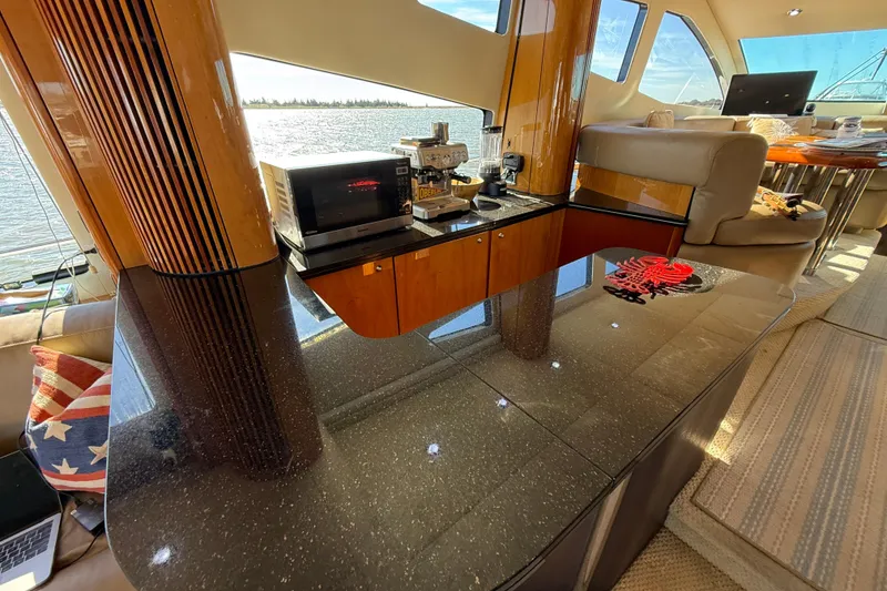 Slide: The Image of Luxurious interior of a 2005 Sunseeker 75 Yacht with modern amenities and elegant design. - 9