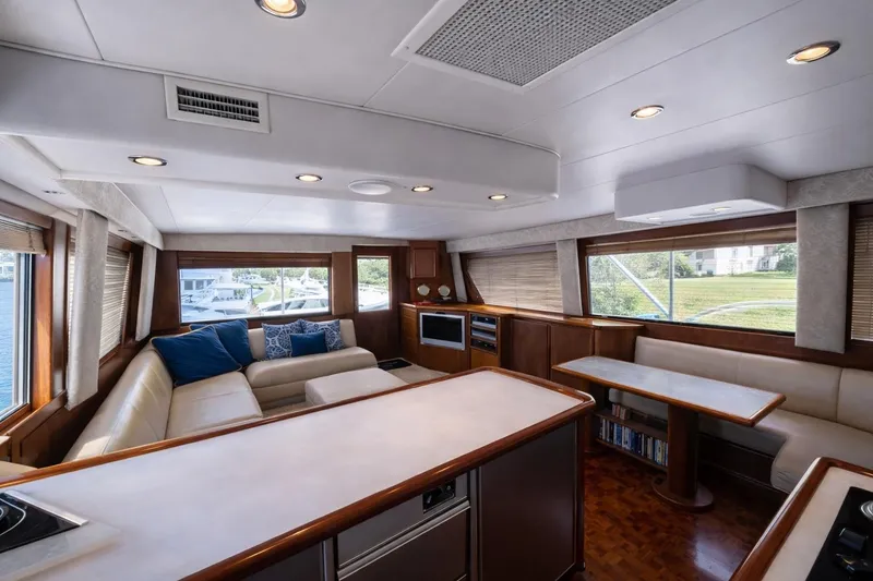 Slide: The Image of Luxurious interior of a 1990 Hatteras 58 Convertible yacht with elegant seating and modern amenities. - 3